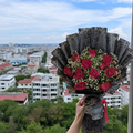 Imported 10 Rose Bouquet with Baby’s Breath & Black Wrap – Luxury Roses Lahore